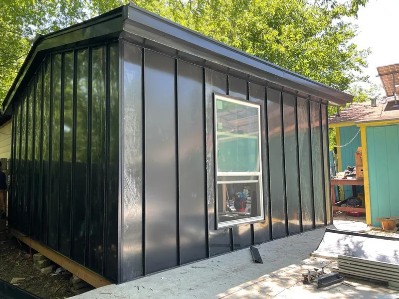 Black standing seam metal wall panels for Roof Inspection in Weston